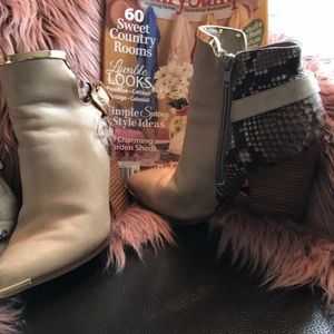 Boots showing slight wear with gold accent .